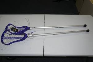 lot 14 image: (2) Under Armour Lacrosse Sticks