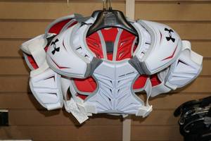 lot 111 image: 3 Under Armour Revenant Shoulder Pads
