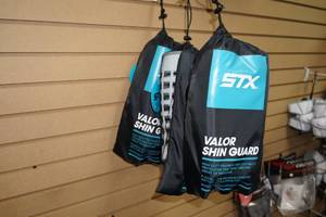 lot 124 image: 3 STX Valor Shin Guards