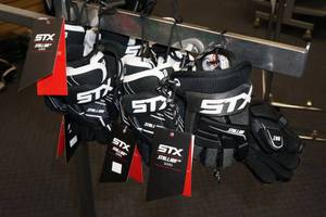 lot 141 image: 4 Sets STX Stallion 50 Youth Gloves