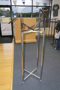 lot 576 image: (1) 4 Way Apparel Rack