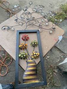 lot 27 image: Lot of two metal wall decor items One with candle holder.