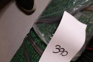 lot 390 image: Grass Look Plastic Feel Rug And black entry way mat