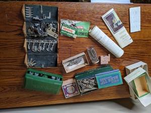 lot 41 image: Lot of Misc Singer Parts and Singer Handheld Machine