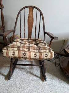 lot 198 image: H40xW215xD25 Wooden Rocker with cushion. Cushion doesnt seem original to chair but fits in a nice oversized manner