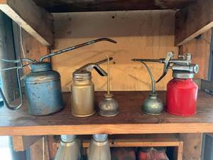lot 207 image: Vintage oil cans and 2 cycle motor oil