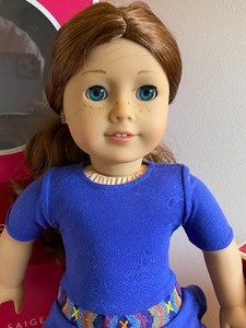 lot 28 image: American Girl Doll named Saige and a Craft Kit