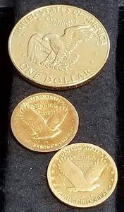 lot 14 image: GROUP OF 3 GOLD PLATED COINS IKE DOLLAR & 2 SILVER STANDING LIBERTY 25C