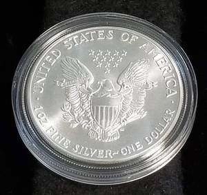 lot 18 image: 1986 AMERICAN SILVER EAGLE 1 TROY OZ. .999 FINE SILVER IN AIRTITE