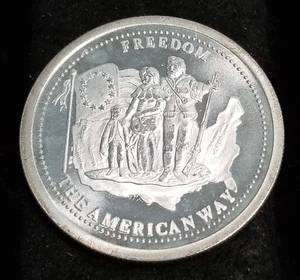 lot 30 image: 1 TROY OZ. .999 FINE SILVER FREEDOM ROUND BY JM JOHNSON MATTHEY