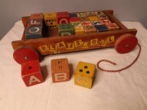 lot 73 image: RARE VINTAGE WOOD BLOCKS WITH FISHER PRICE PULL WAGON