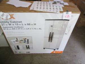 lot 928 image: HDX Utility Cabinet 27 X 15 X 68...