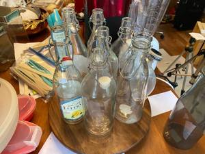 lot 843 image: Glass Bottle Lot &Wood Lazy Susan...