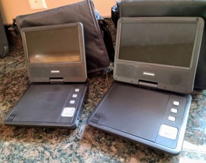 lot 307 image: Pair Of Sylvania Traveling DVD Players