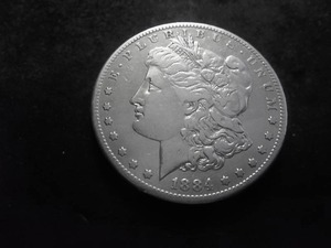 lot 16 image: 1884 S Morgan Silver Dollar