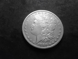 lot 20 image: 1886 O Morgan Silver Dollar
