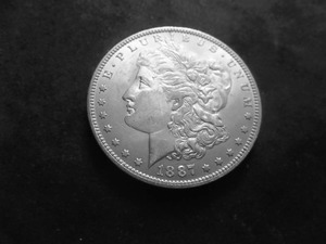 lot 22 image: 1887 O Morgan Silver Dollar