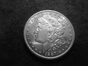lot 23 image: 1887 S Morgan Silver Dollar