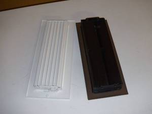 lot 77 image: 2 Vent covers-Brown One has a Fin Broke-Open Box