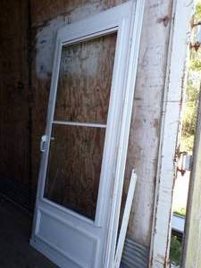 lot 76 image: 32 Storm Door with Frame and pull down Screen