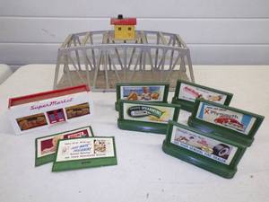 lot 15 image: Vintage Railroad Accessories with Metal Bridge Billboard Advertisements