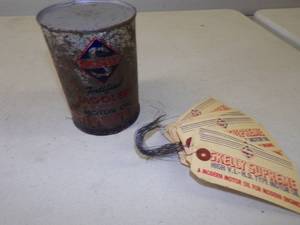 lot 44 image: Full Skelly Tagolene Motor Oil and lot of Skelly Oil Drum Tags unused