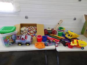 lot 131 image: Large Lot of Childrens toys Legos, Squirt Guns and beach accessories