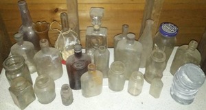 40  bottles & jars, galvanized lids too.