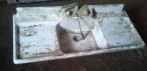 Enamel cast sink - about 5 feet long.