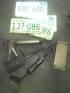 Vintage metal roadside flare kit � complete. .grease guns license plates