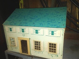 Doll house 1.5 story � pressboard material - good condition.