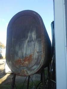 Elevated 500 gallon fuel tank with hose and handle