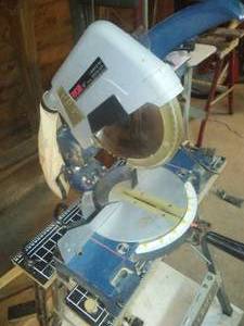 lot 106 image: Ryobi 10 in. Compound Miter Saw with Stand.