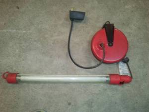 lot 82 image: Craftsman Retractable Electric Cord and Light.