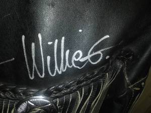 lot 195 image: Autographed Fringed Leather Jacket - Willie G., Nancy, and John Davidson