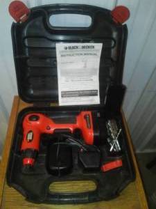 lot 287 image: Black and Decker Battery Drill, working, 12v charger, 2 batteries, drill and accessories.
