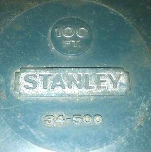 lot 332 image: 100 foot Stanley tape &Misc. Accessories drills bits, spark plug wrenches, tape measures.