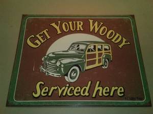 lot 482 image: Get Your Woody Metal Sign.