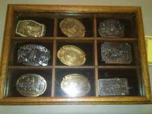 lot 497 image: Belt Buckle Collection with Display Case. 9 Buckles including CM Russel Limited Edition w COA.