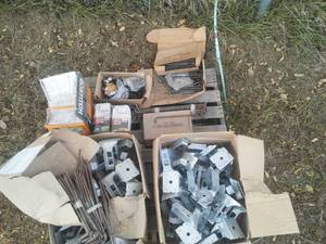 lot 388 image: Misc. cement anchors, joist hangers, Bostitch Stanley Air nails.