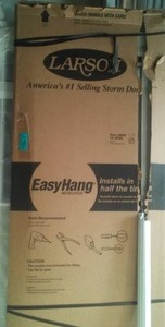 lot 82 image: Larson Storm Door Complete in box 36 in.