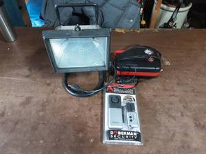 lot 34 image: Work Light, 12 Volt Compressor, NEW Tool Box Alarm