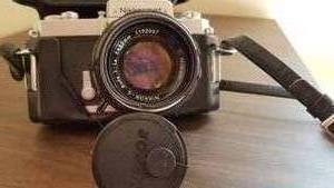 lot 105 image: Nikon Nikkormat 35mm SLR Camera with 50mm Nikon Lens