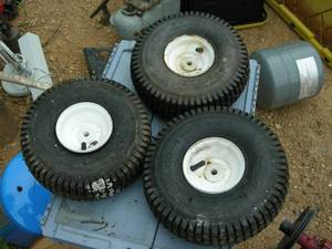 lot 36 image: Set of 3 11x4.00-4 Utility Wheels
