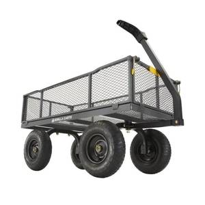 lot 203 image: Gorilla Carts 6-cu ft Steel Utility Cart GOR-2345 - One Wheel is Severely Sliced through tread and sidewall - Assembly required.