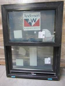 lot 613 image: Andersen Series 100 Single Hung Vinyl Window in Black. Measures Approximately 29 12 x 39 x 2