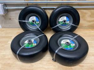 lot 4 image: ARNOLD Set of Four- 13 in. x 5 in. Universal Flat Free Zero Turn Front Wheel Assembly with Smooth Tread