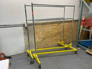 lot 9 image: IRSG Lot of Two- ClothingWarehouse Racks on Casters