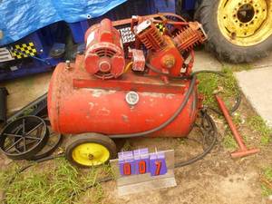lot 7 image: 110 volt air compressor. Needs a little tlc. Tested & works. As shown.