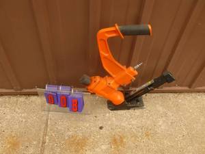 lot 8 image: Air powered flooring nailer. Used for 1 10 x 20 room. Nearly new condition. As shown.